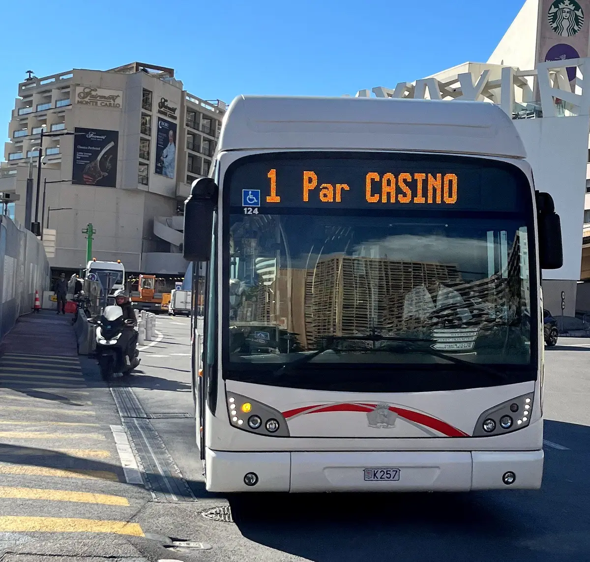A white CAM city bus showing line 1 to the Casino, at a stop in Monaco