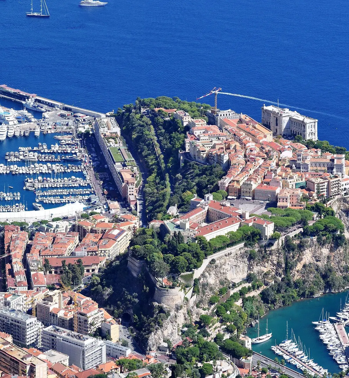 Port Hercule full of yachts below the Rock of Monaco, seen from high above